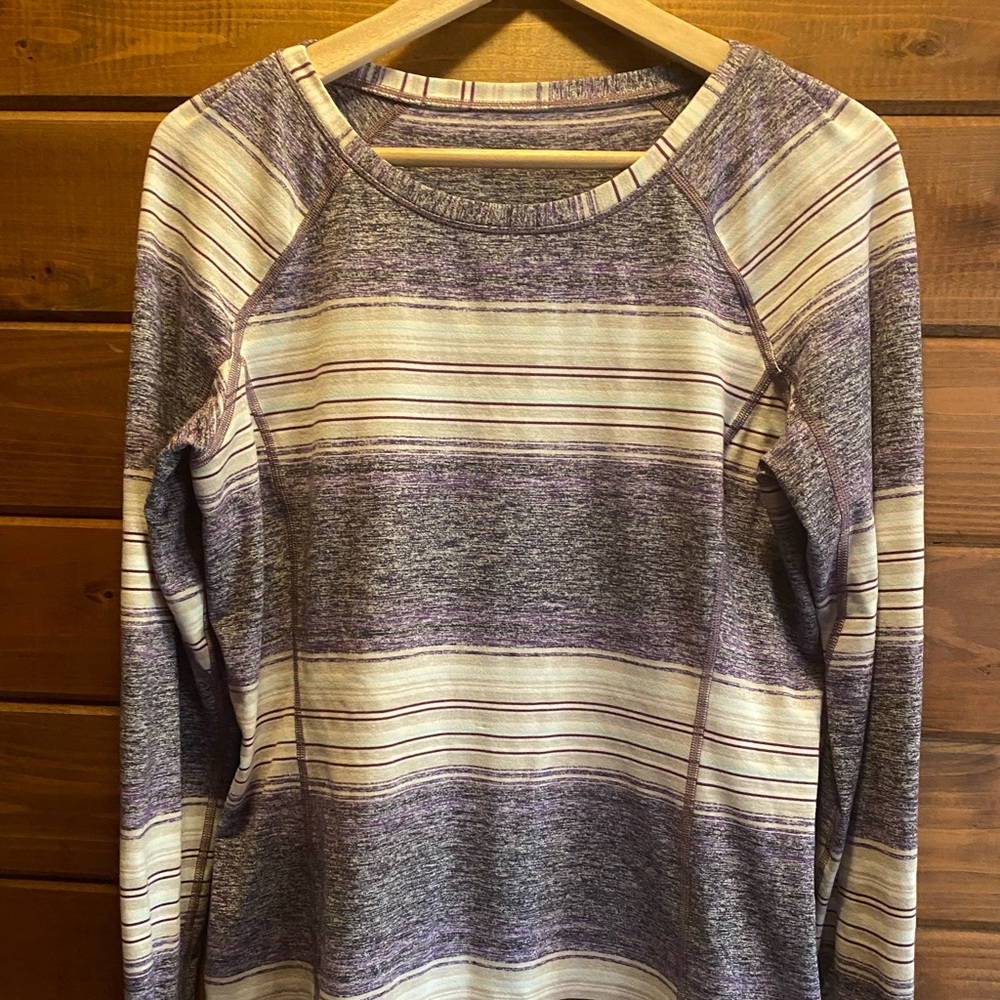 Gently used long-sleeved beautiful Lululemon shirt with key pocket.